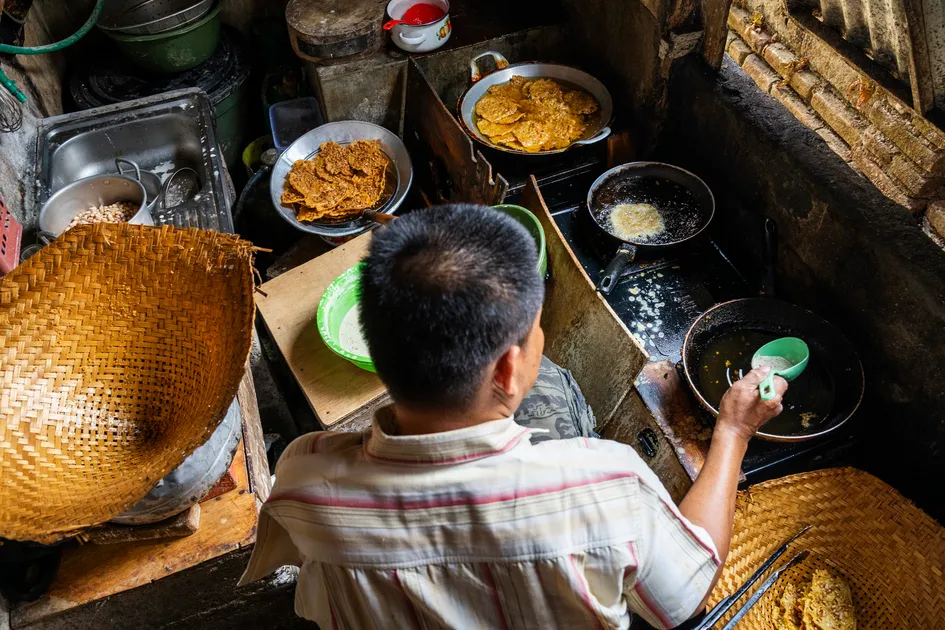 Banu fries up a local delicacy that helps fund their ministry efforts. One day soon, he and Neli hope to build a church on a nearby plot of land.