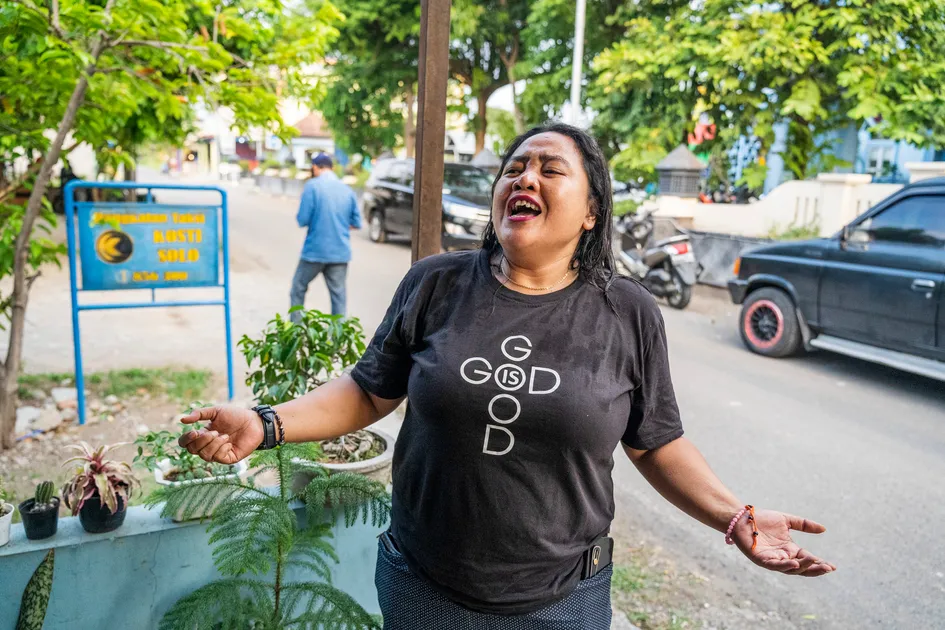 Rahel, the evangelist who led Deni to the Lord, worships outside her restaurant. The shop also serves as a place of ministry for people on the fringes of society.